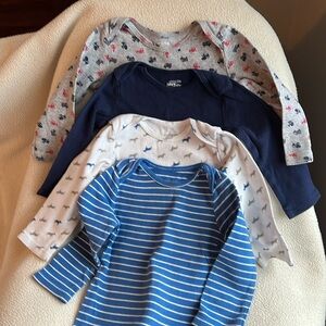 Four Carter onesies size 18 months.